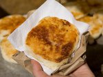 A delicious arepa con queso on the street in Cartagena, Colombia.