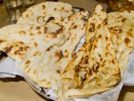 One of many wonderful Indian breads in New Delhi, India: a basket of fresh naan.