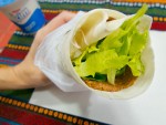 Turkish durum in Istanbul, a sandwich with meat and lettuce wrapped up tightly in lavash bread. 
